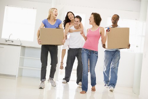 Removal team loading boxes and furniture for a UK move