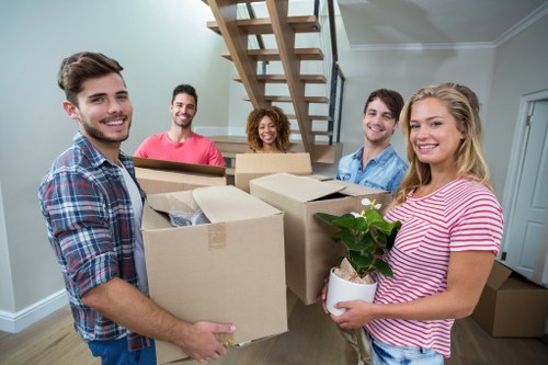 Packed boxes and furniture ready for a flat removal in West Kensington