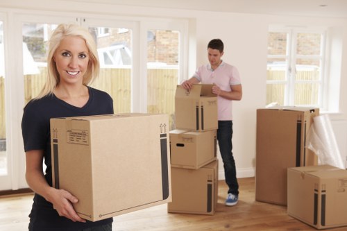 Professional team loading furniture for a house move in West Kensington