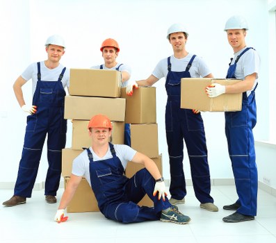 Mover wearing PPE while handling furniture safely