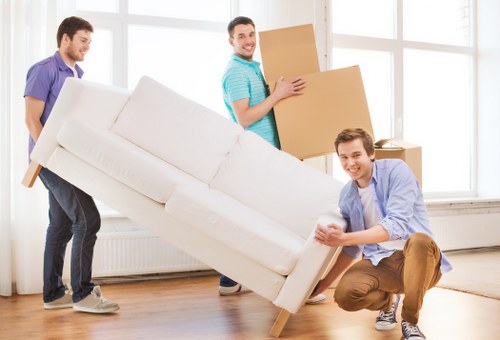 Careful loading of household items during a West Kensington relocation
