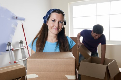 Professional movers handling fragile items during a West Kensington relocation