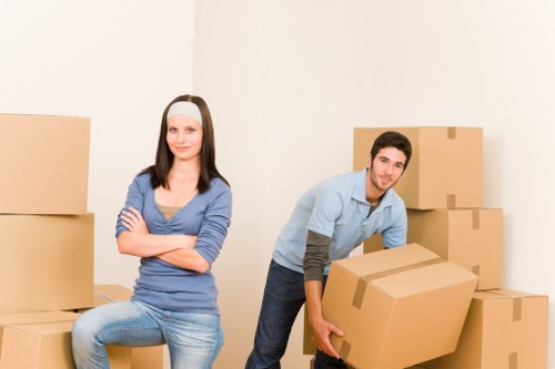 Furniture and boxes being transported during a home move across West Kensington