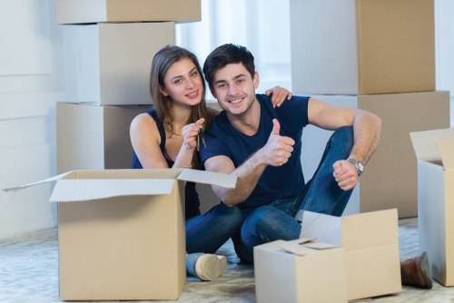 Packed boxes and furniture prepared for a residential relocation in West Kensington
