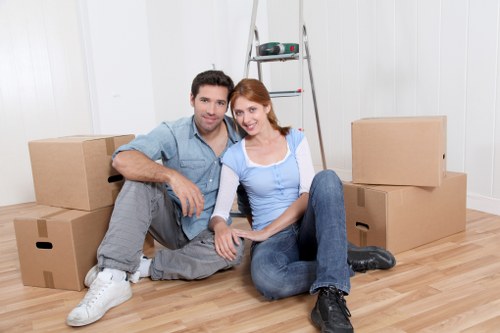 Careful handling of household items during a West Kensington delivery
