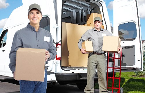Office furniture and equipment being prepared for a commercial move
