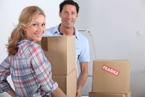 Packed moving boxes and furniture ready for removal services in West Kensington