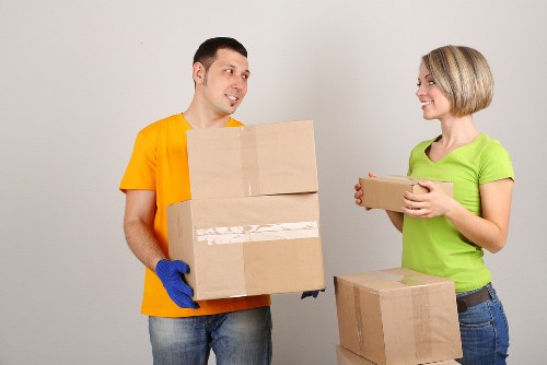 Professional movers handling a residential move in a West Kensington property