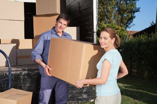 Careful handling of boxes and household items during a West Kensington removal