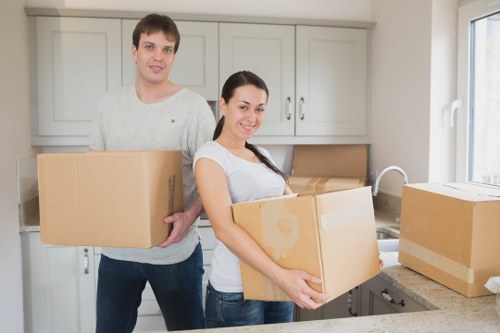 Professional movers preparing belongings for transport in West Kensington